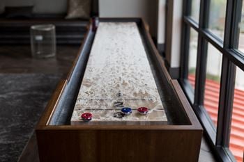 Open air game room with golden tee golf video game, billiards, and much more